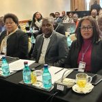 Representantes do IPEME, sentados em auditório